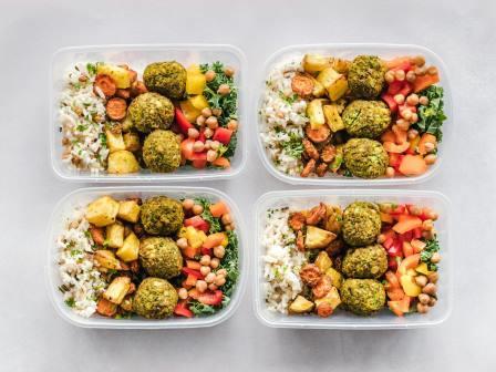 Four containers with the same meal. Meal prepping is a great way to use ingredients.