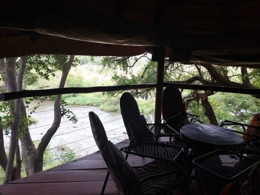 Deck overlooking the river from the Tree Lodge